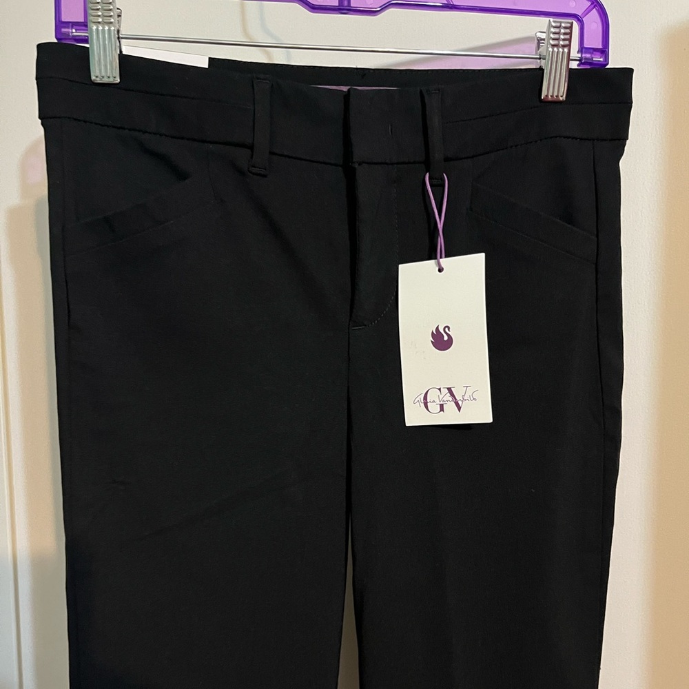 New with tags Gloria Vanderbilt brand black slacks. Size four.